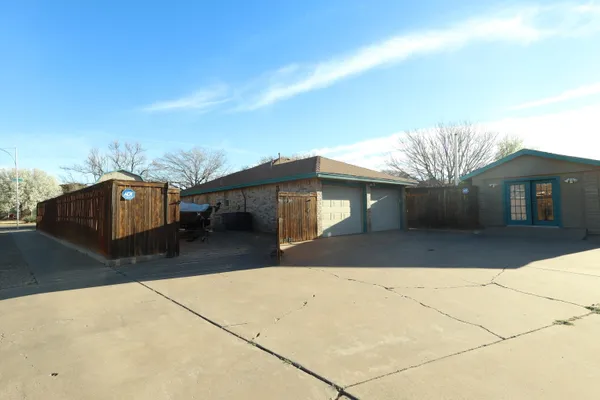 a view of a house with a yard and garage