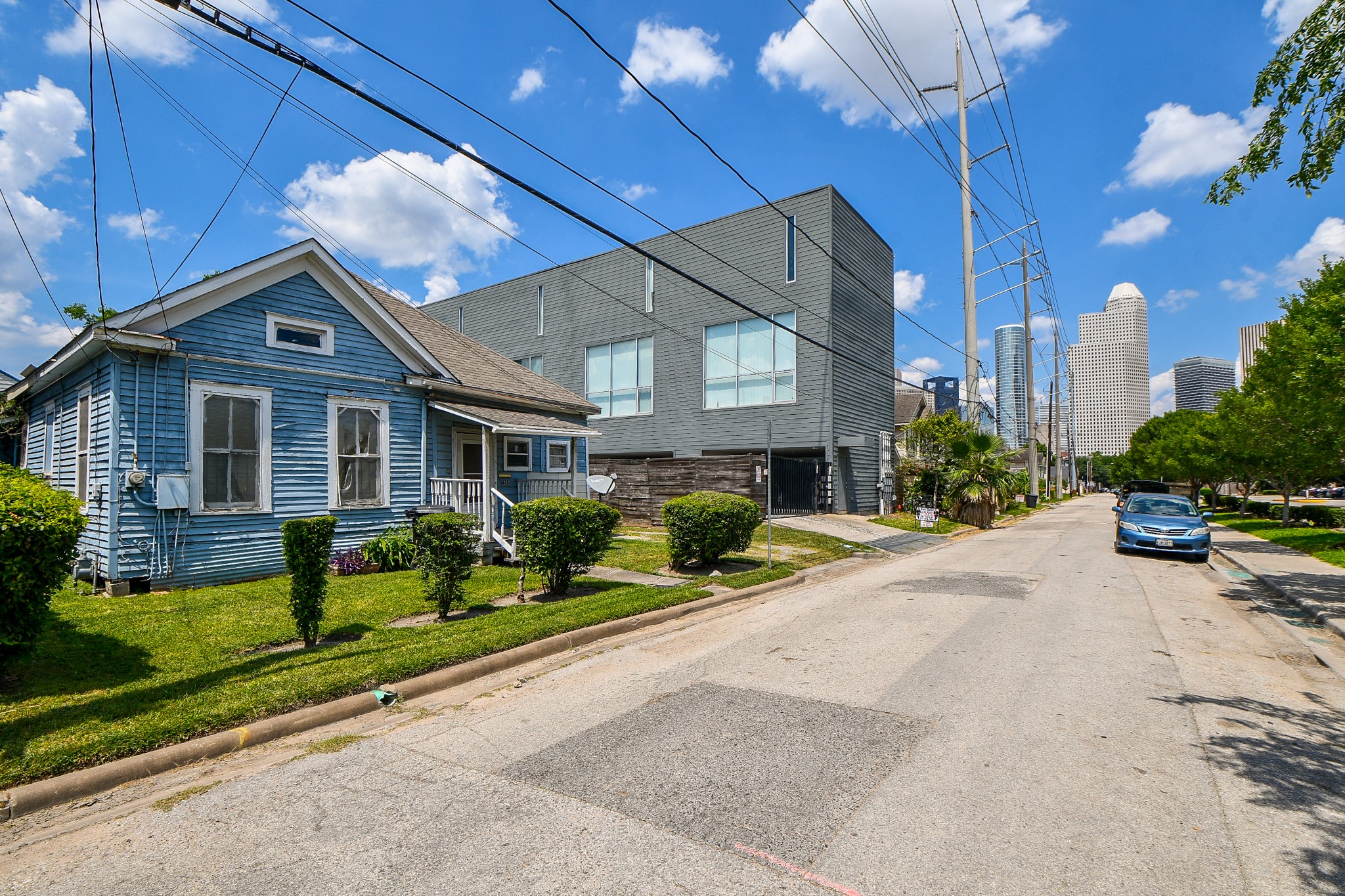 1318 Cleveland Street Houston, TX 77019 - Photo 2 of 7 a front view of a house with a yard outdoor seating and garage