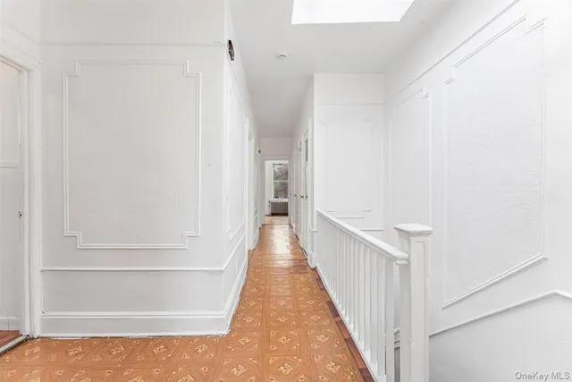 a close view of a black and white checkered floor with a rug