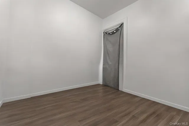 a view of a chandelier with a painting on the wall