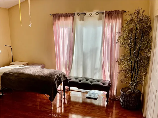 a bedroom with a bed and a closet with mirror