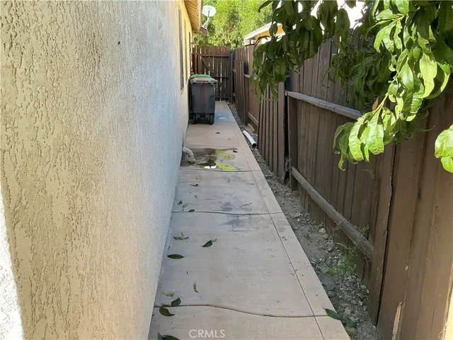 a view of a pathway besides a house