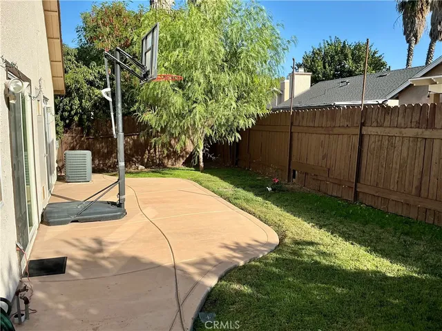 a view of backyard with tub