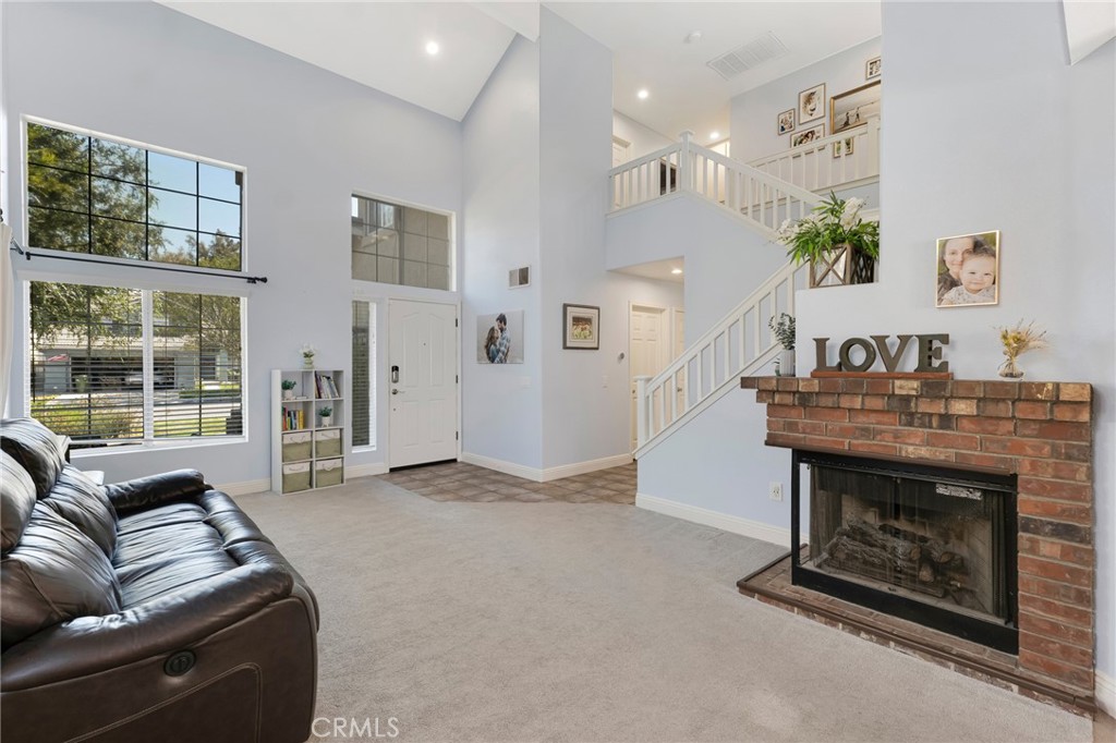 3843 San Gabriel Street Simi Valley, CA 93063 - Photo 2 of 52 a living room with furniture and a fireplace
