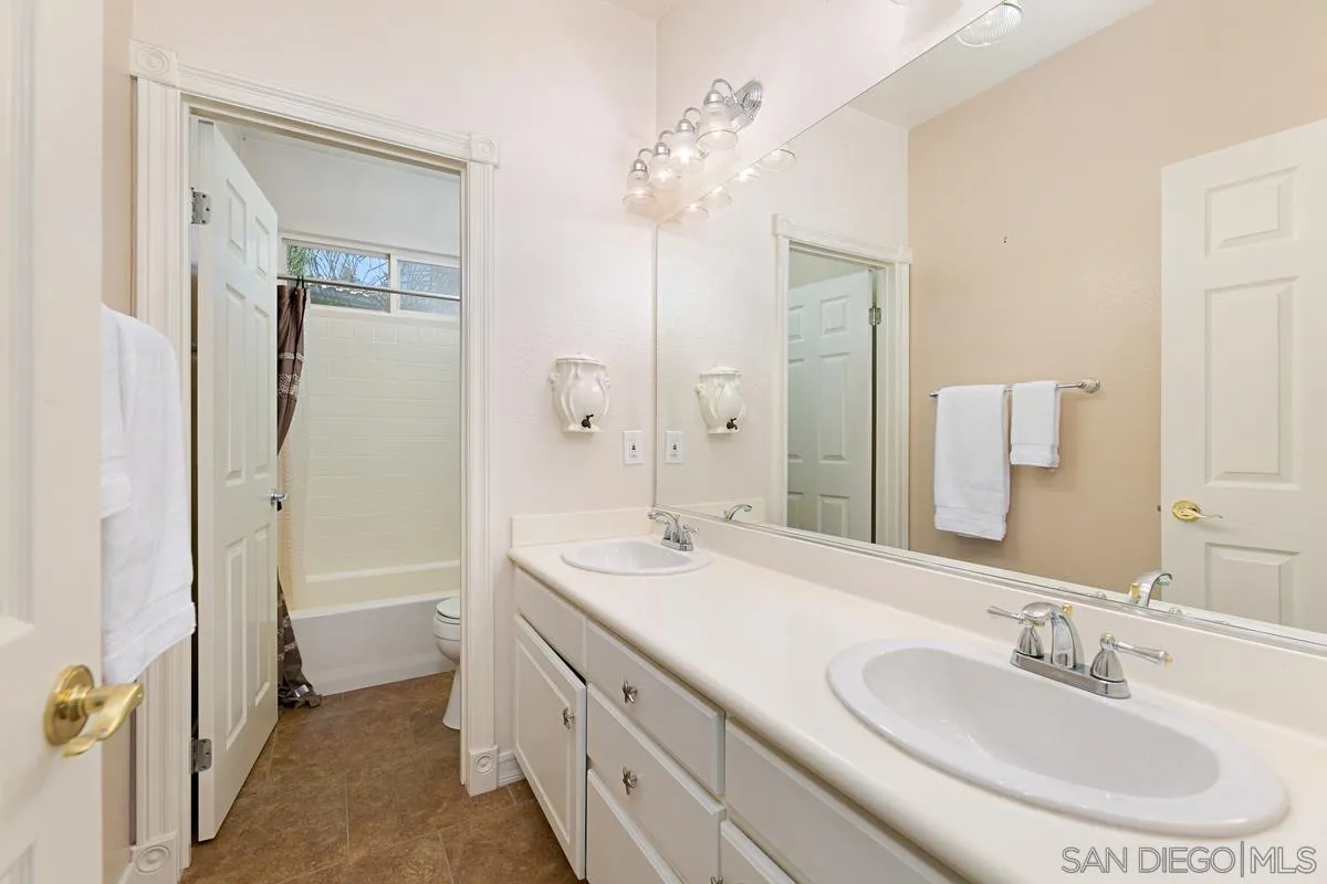 2902 Rancho Rio Chico Carlsbad, CA 92009 - Photo 19 of 30 a bathroom with a double vanity sink mirror and double