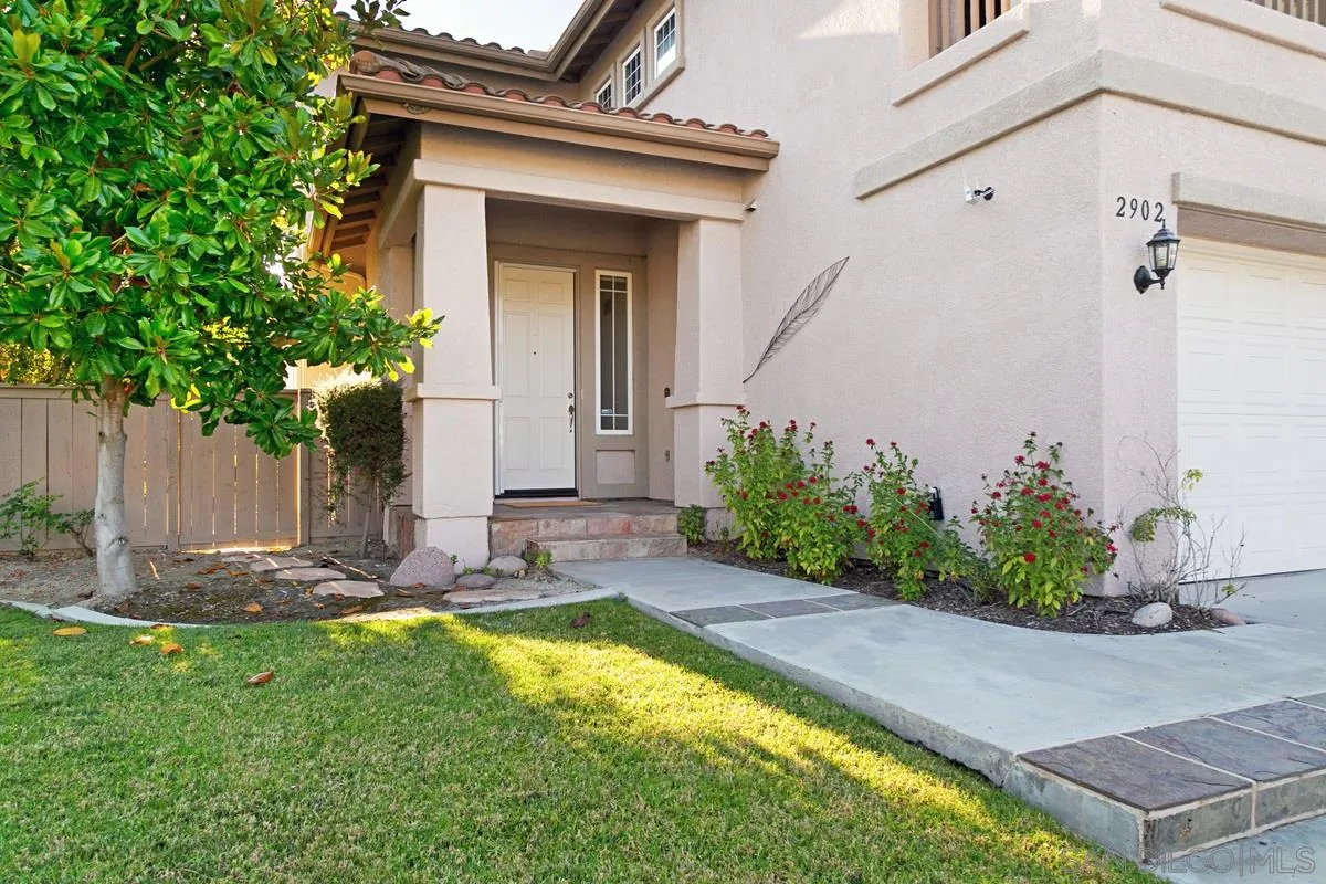 2902 Rancho Rio Chico Carlsbad, CA 92009 - Photo 3 of 30 a front view of a house with a yard
