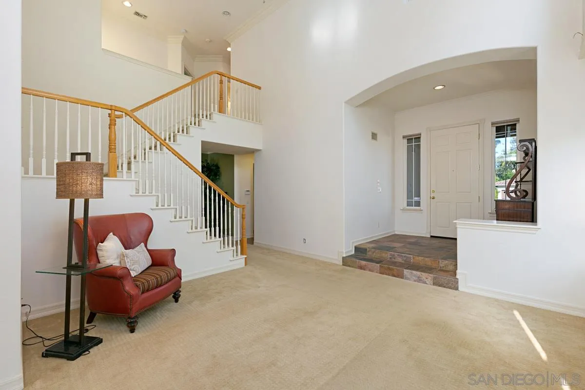 2902 Rancho Rio Chico Carlsbad, CA 92009 - Photo 4 of 30 a dining room with furniture and stairs