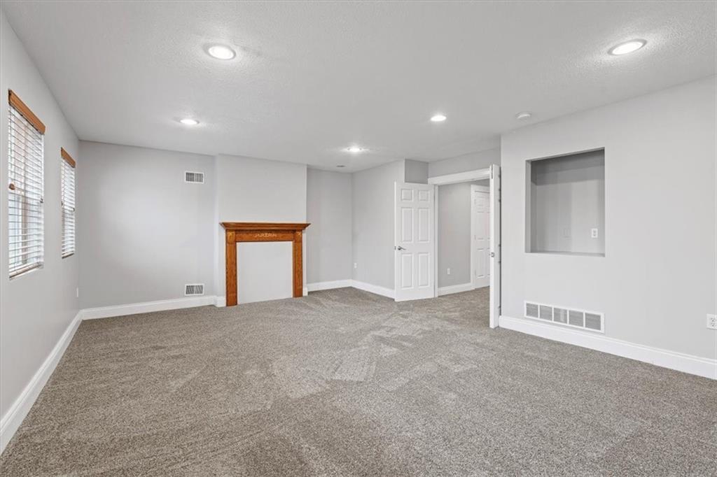 1302 Sarah Street Pittsburgh, PA 15203 - Photo 14 of 25 an empty room with windows and closet