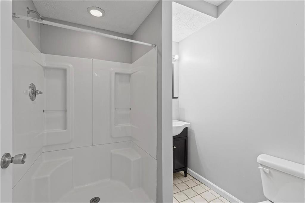 1302 Sarah Street Pittsburgh, PA 15203 - Photo 19 of 25 a bathroom with a shower and toilet