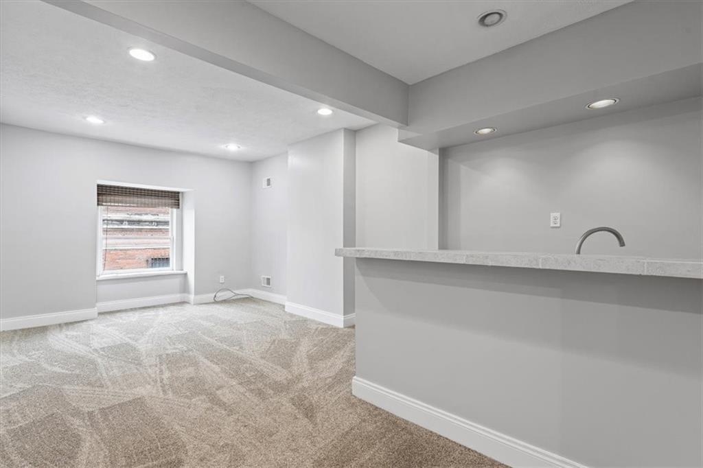 1302 Sarah Street Pittsburgh, PA 15203 - Photo 20 of 25 a view of an empty room with a window