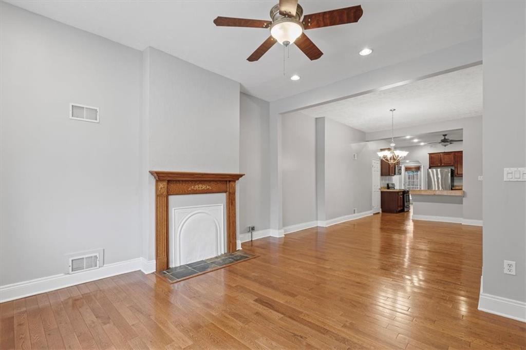 1302 Sarah Street Pittsburgh, PA 15203 - Photo 6 of 25 a view of an empty room with window and wooden floor