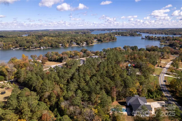 a view of a lake with houses in the back