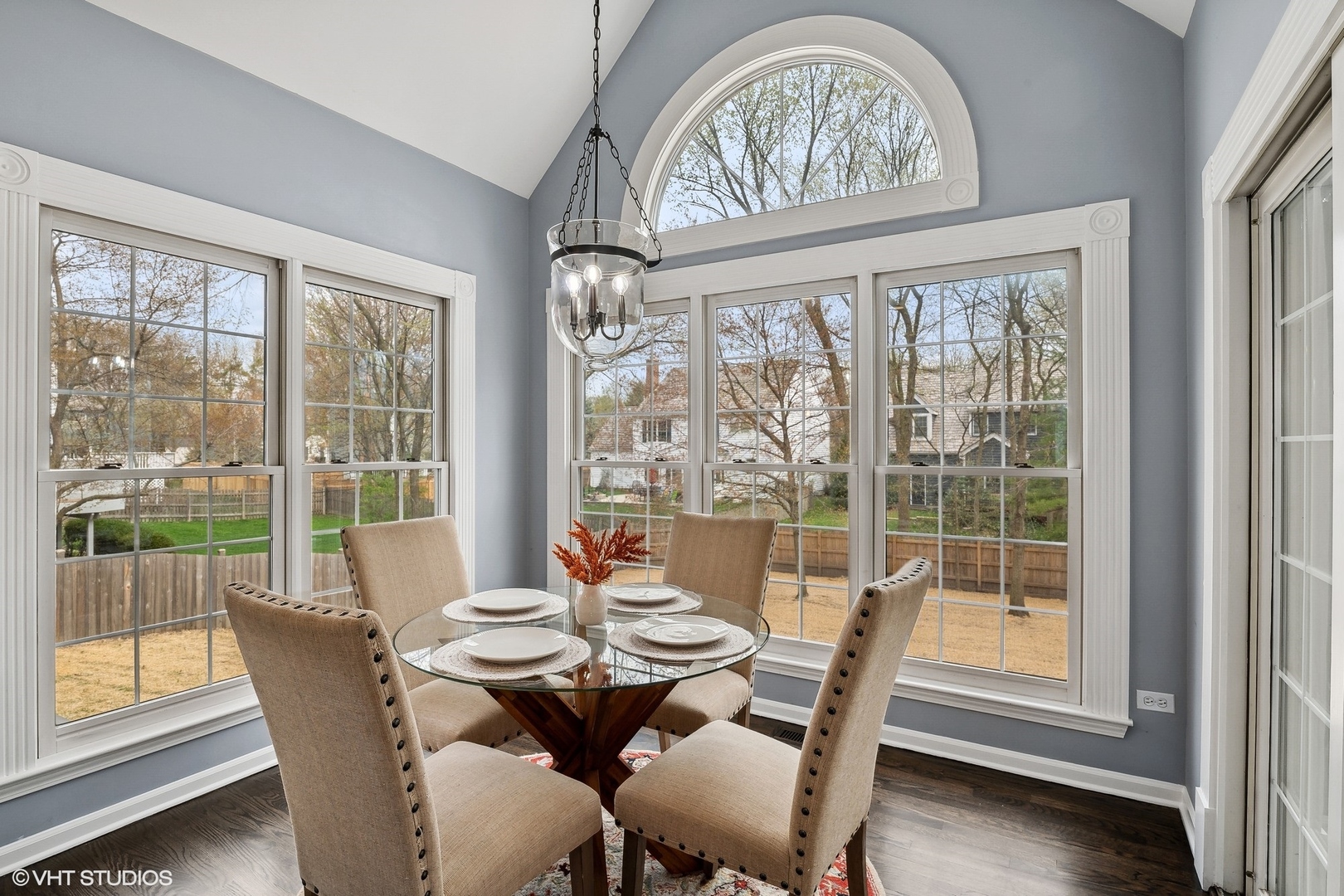 665 Angelo Avenue Gurnee, IL 60031 - Photo 11 of 34 a dining room with furniture large windows and a chandelier