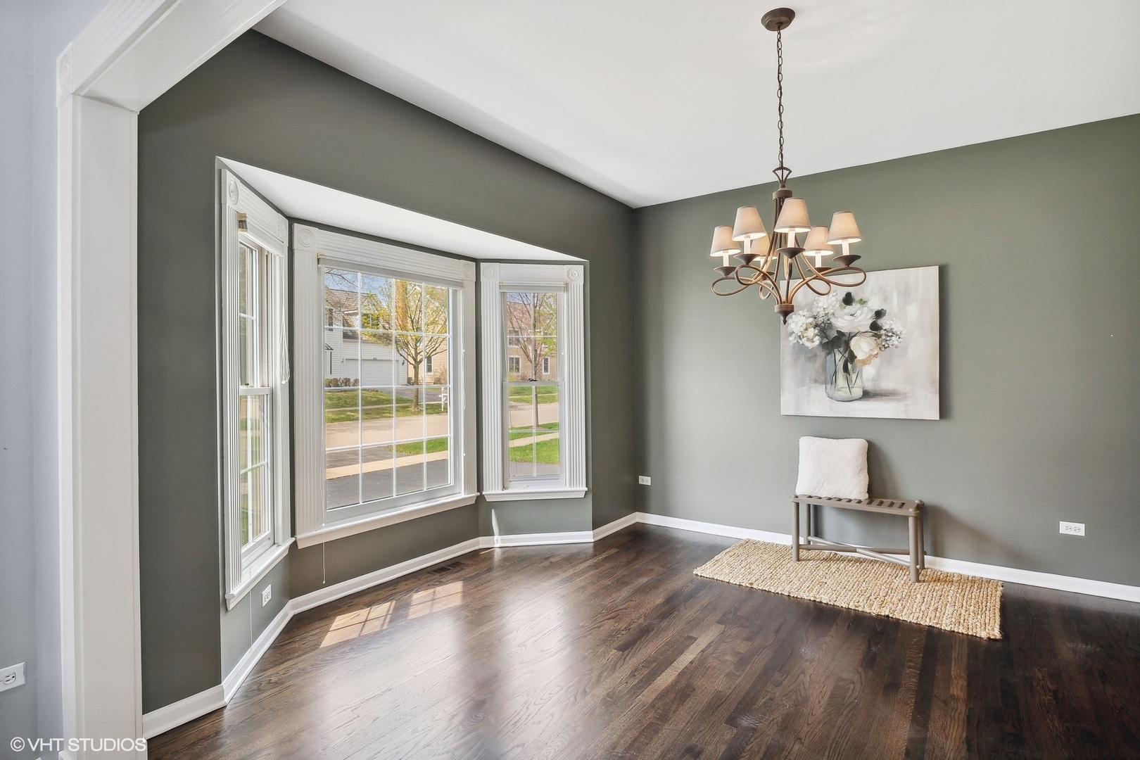 665 Angelo Avenue Gurnee, IL 60031 - Photo 12 of 34 a view of an empty room with a window and wooden floor