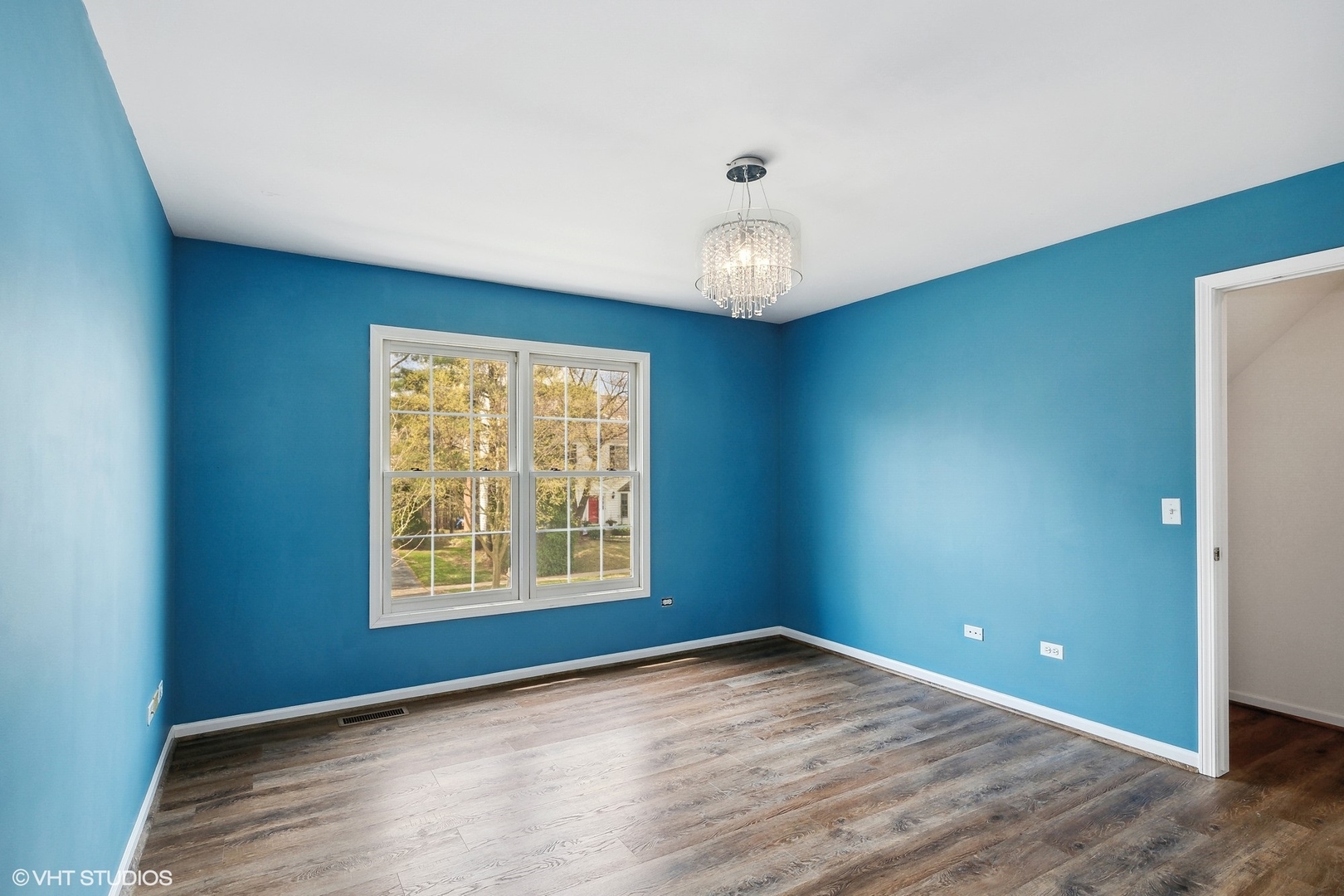 665 Angelo Avenue Gurnee, IL 60031 - Photo 25 of 34 an empty room with wooden floor and windows