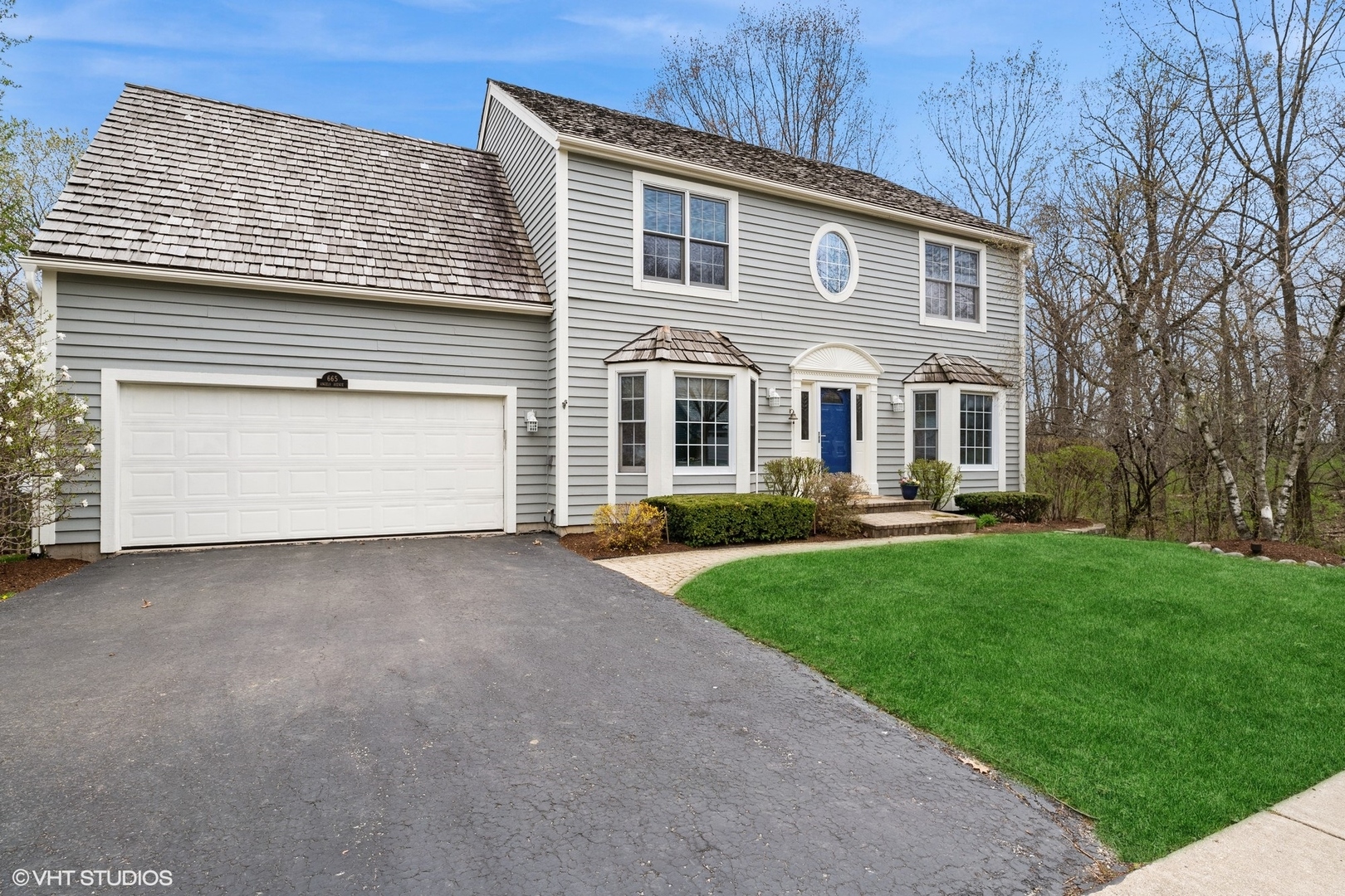 665 Angelo Avenue Gurnee, IL 60031 - Photo 3 of 34 a front view of a house with a yard and garage