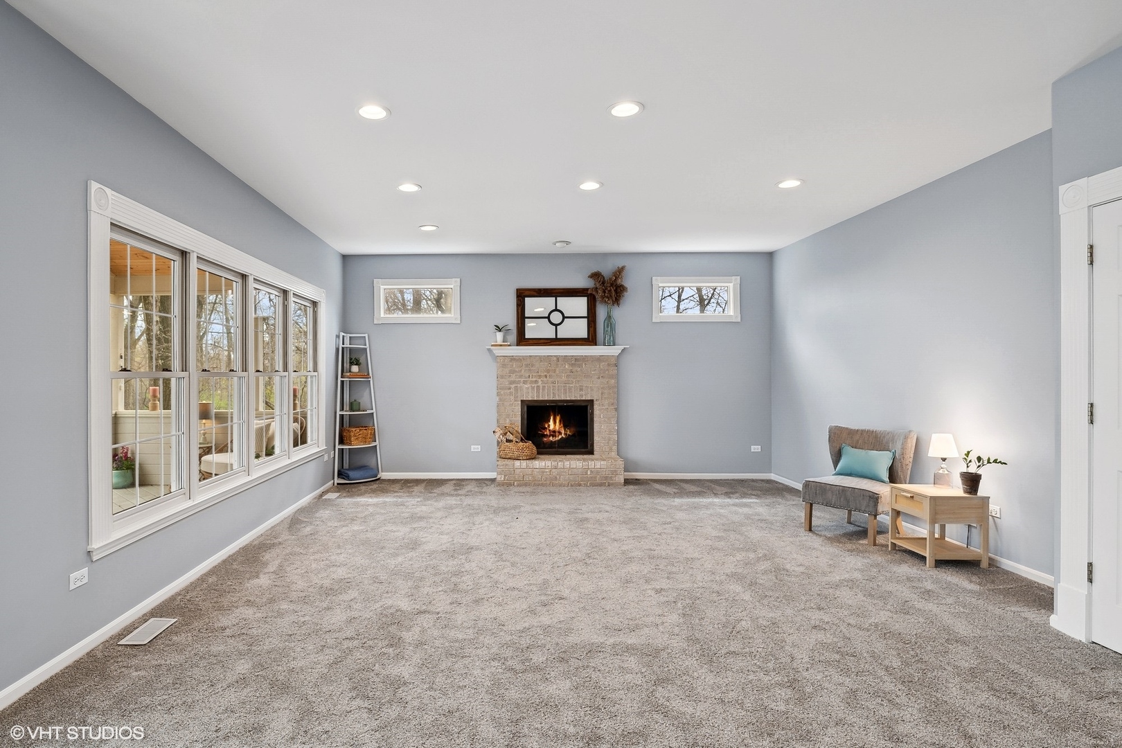 665 Angelo Avenue Gurnee, IL 60031 - Photo 10 of 34 a view of an empty room with a fireplace and a window