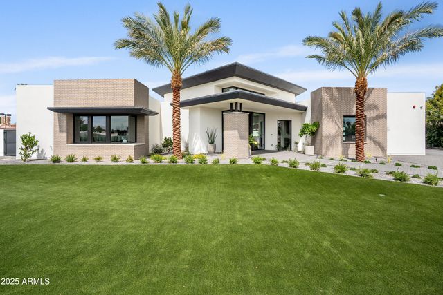 a view of a house with backyard porch and patio