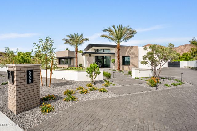 a living room with furniture and a kitchen view
