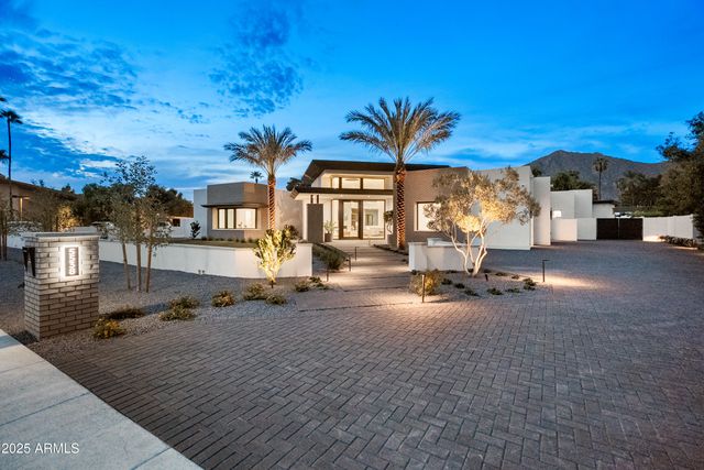 a spacious bathroom with a double vanity sink and a large mirror