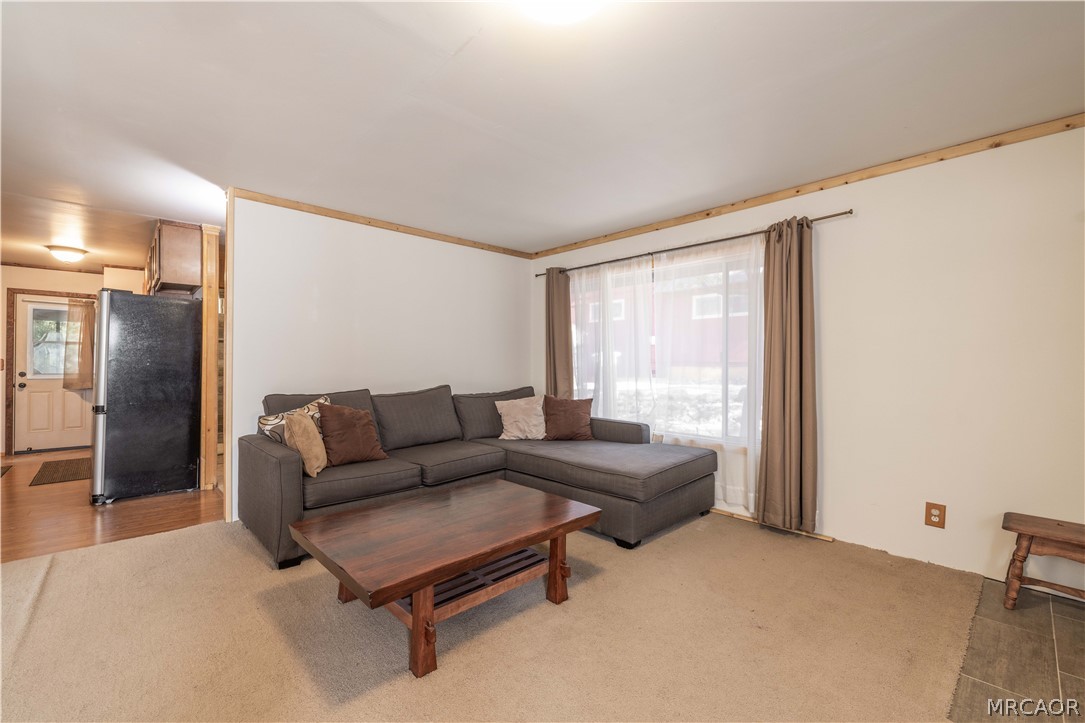 773 Sunset Lane Sugarloaf, CA 92386 - Photo 5 of 33 a living room with furniture and a window