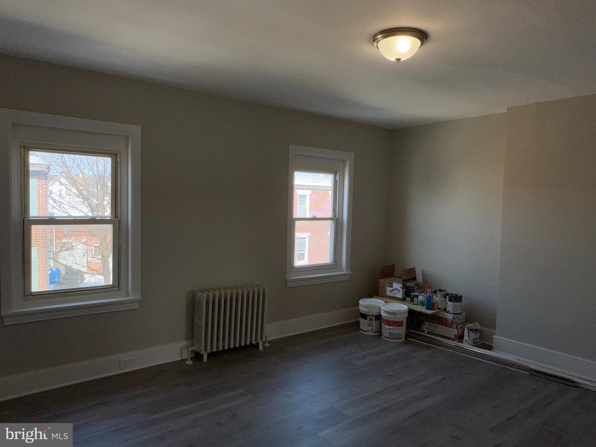 706 Chain Street, Unit 3 Norristown, PA 19401 - Photo 12 of 15 a living room with furniture and a window