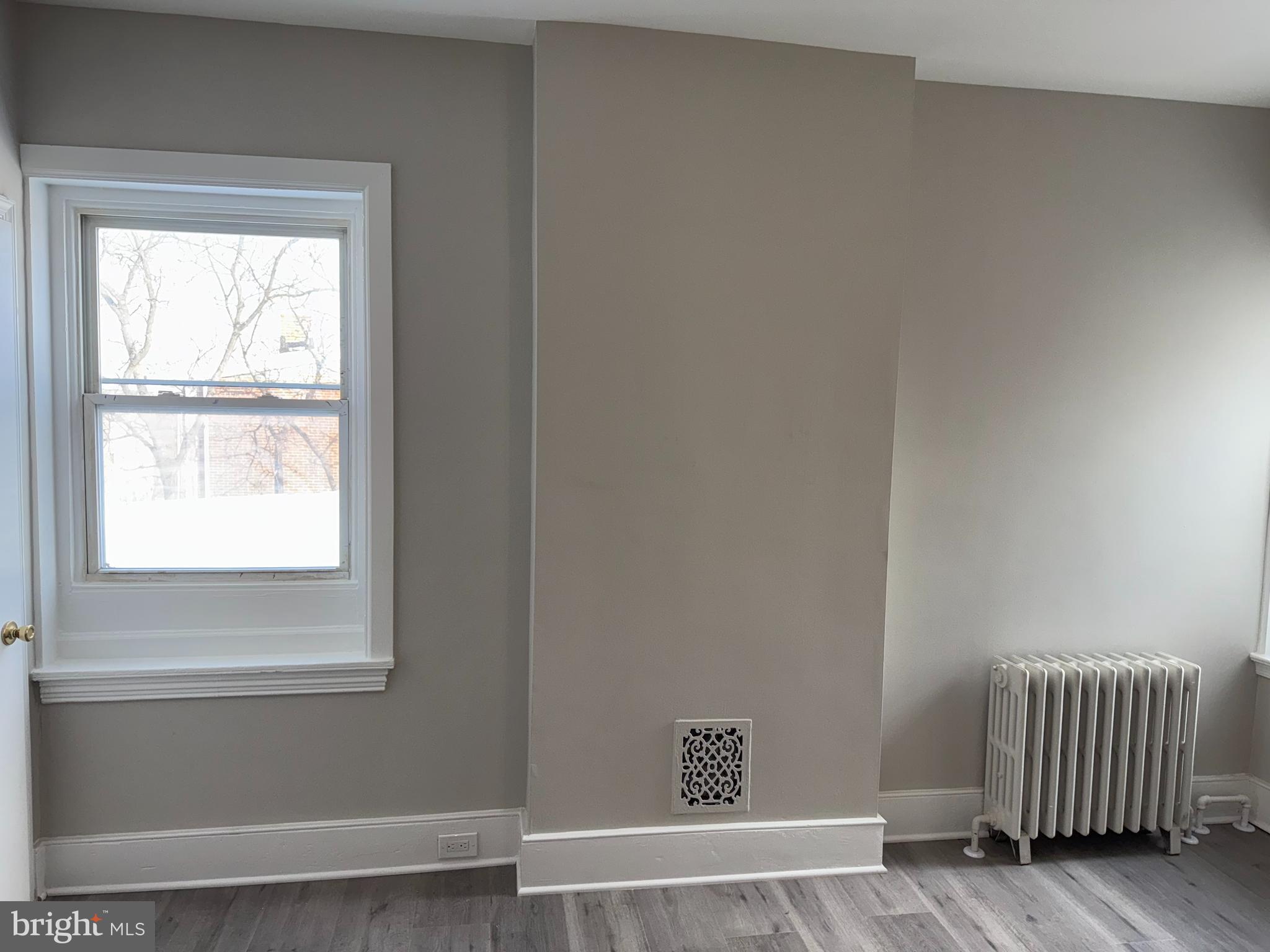 706 Chain Street, Unit 3 Norristown, PA 19401 - Photo 13 of 15 a view of room with window and wooden floor
