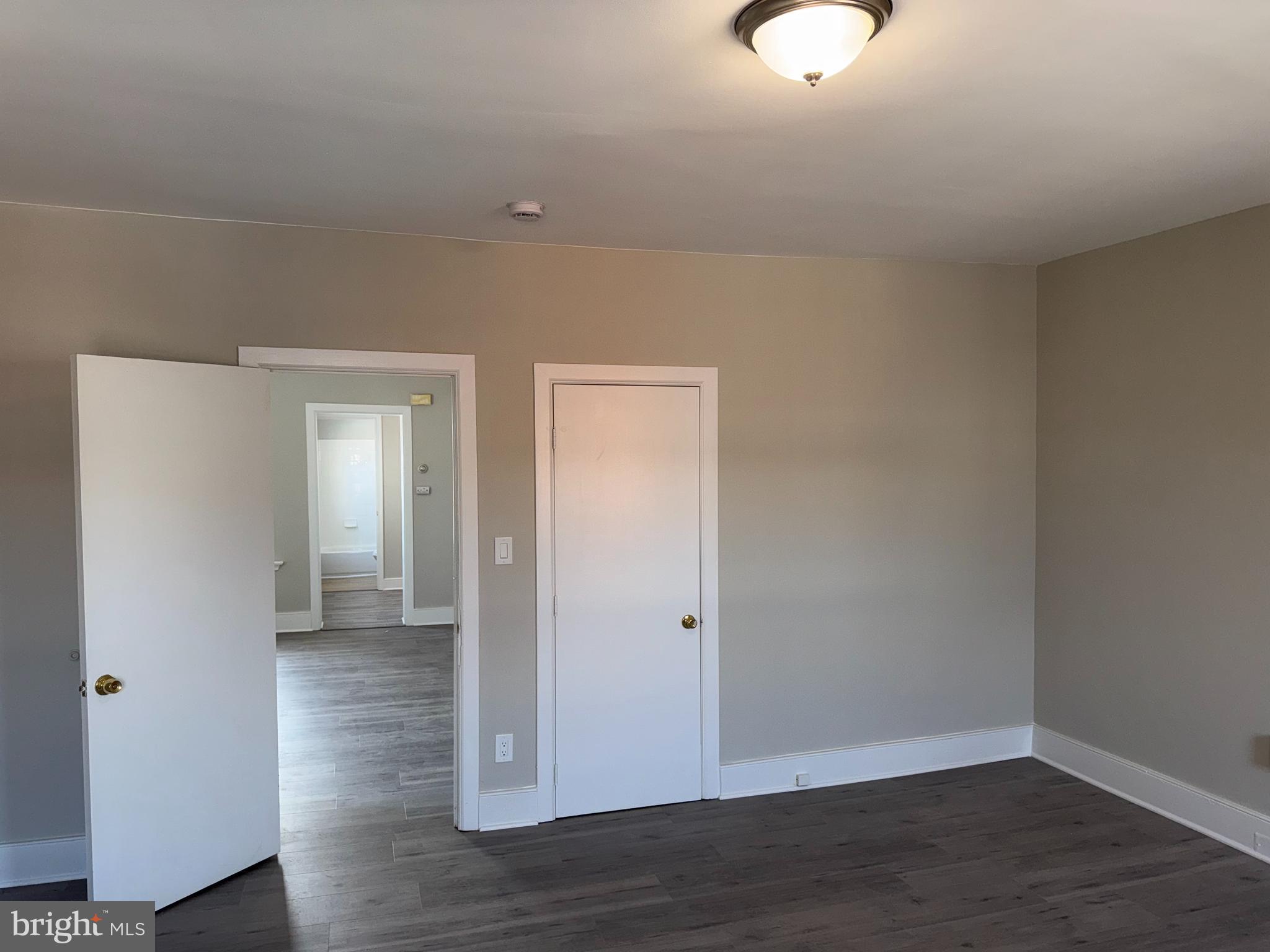 706 Chain Street, Unit 3 Norristown, PA 19401 - Photo 4 of 15 a view of an empty room with wooden floor