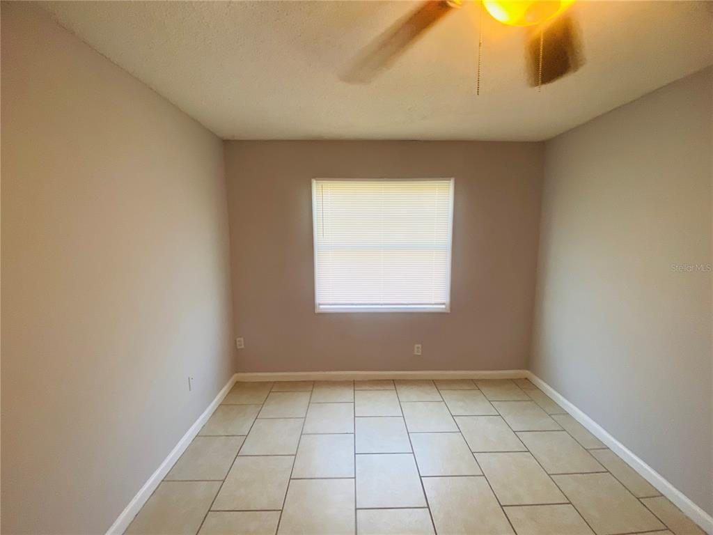 2771 L B McLeod Road, Unit A Orlando, FL 32805 - Photo 12 of 17 an empty room with a window
