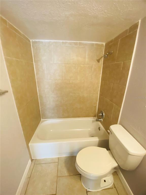 2771 L B McLeod Road, Unit A Orlando, FL 32805 - Photo 14 of 17 a bathroom with a toilet and a shower