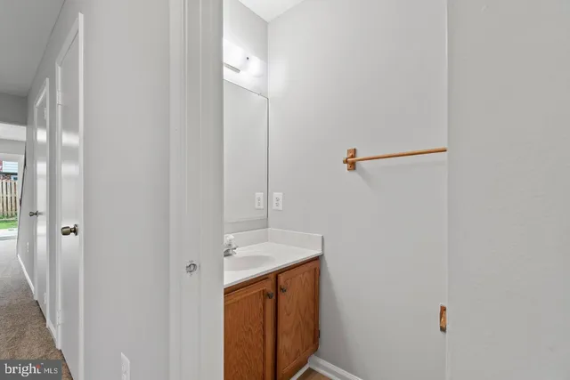 a bathroom with a sink and shower