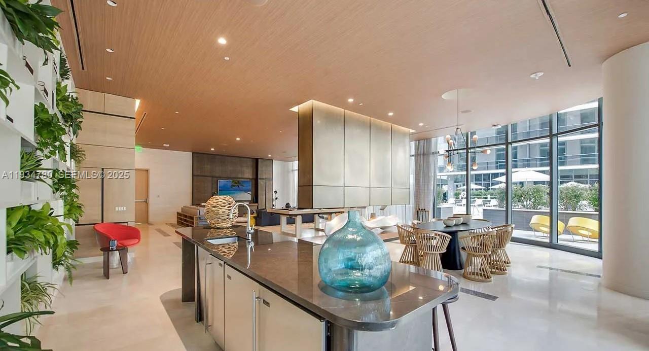 45 Southwest 9th Street, Unit 3210 Miami, FL 33130 - Photo 12 of 20 a living room with furniture and a potted plant