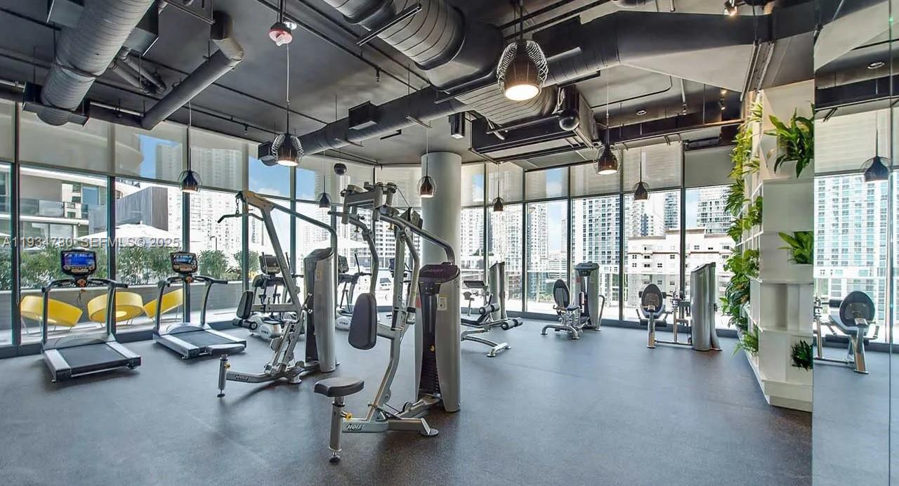 45 Southwest 9th Street, Unit 3210 Miami, FL 33130 - Photo 13 of 20 a view of a room with gym equipment