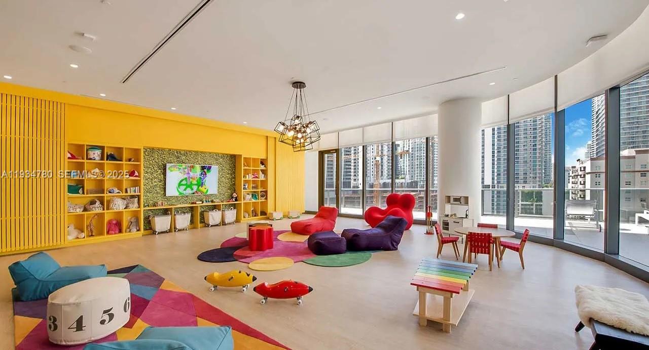 45 Southwest 9th Street, Unit 3210 Miami, FL 33130 - Photo 15 of 20 a living room with furniture and a large window