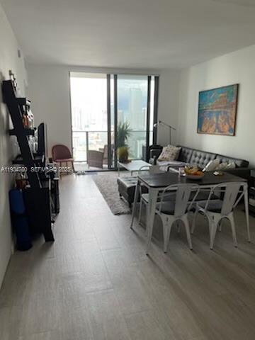 45 Southwest 9th Street, Unit 3210 Miami, FL 33130 - Photo 2 of 20 a view of a dining room with furniture window and outside view