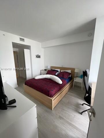 45 Southwest 9th Street, Unit 3210 Miami, FL 33130 - Photo 5 of 20 a bedroom with a bed and a desk