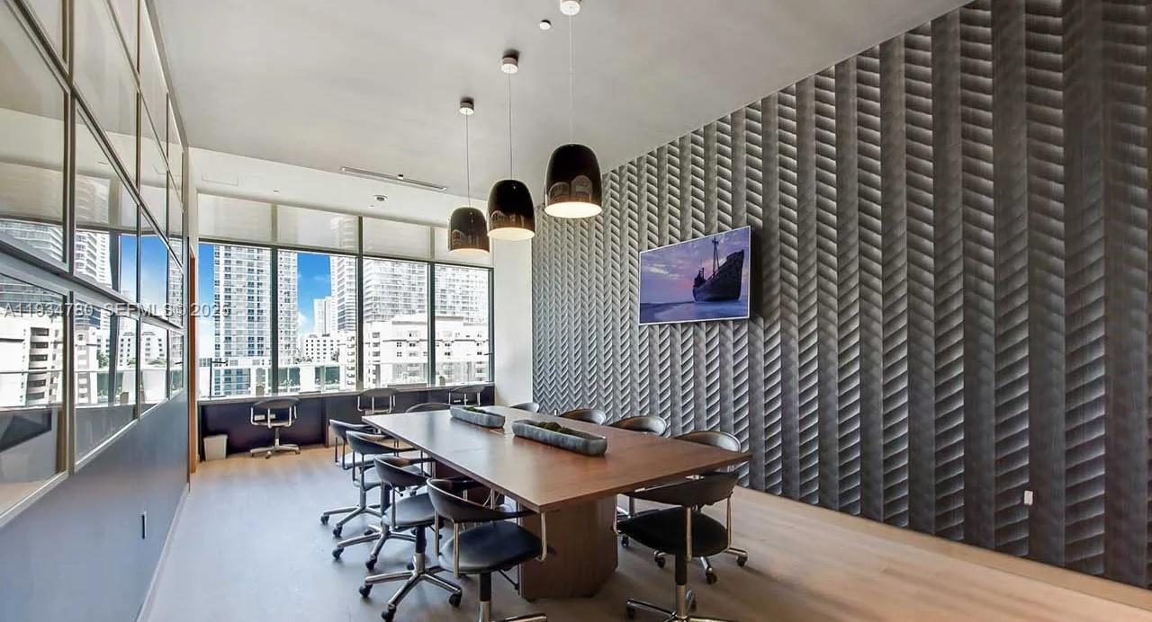 45 Southwest 9th Street, Unit 3210 Miami, FL 33130 - Photo 10 of 20 a workspace with furniture and window