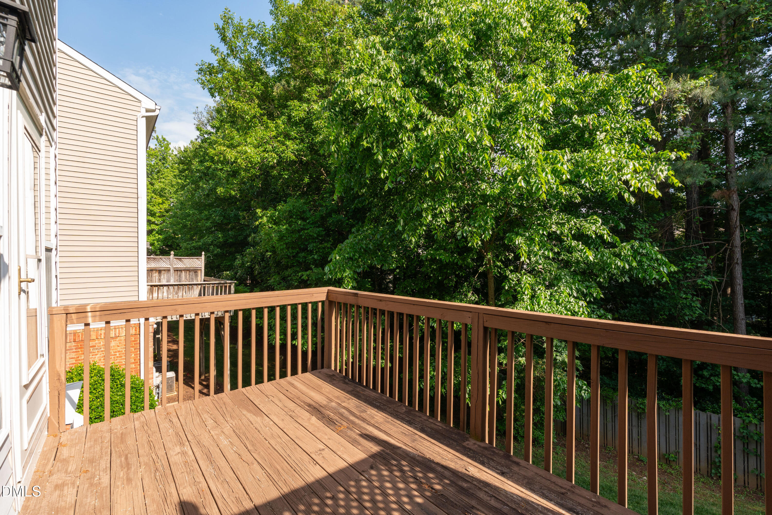 5421 Golden Arrow Lane Raleigh, NC 27613 - Photo 41 of 49 a balcony with wooden floor and outdoor space