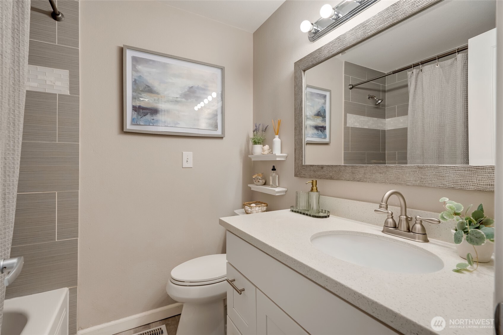 825 Index Court Northeast Renton, WA 98056 - Photo 26 of 40 a bathroom with a toilet sink and mirror