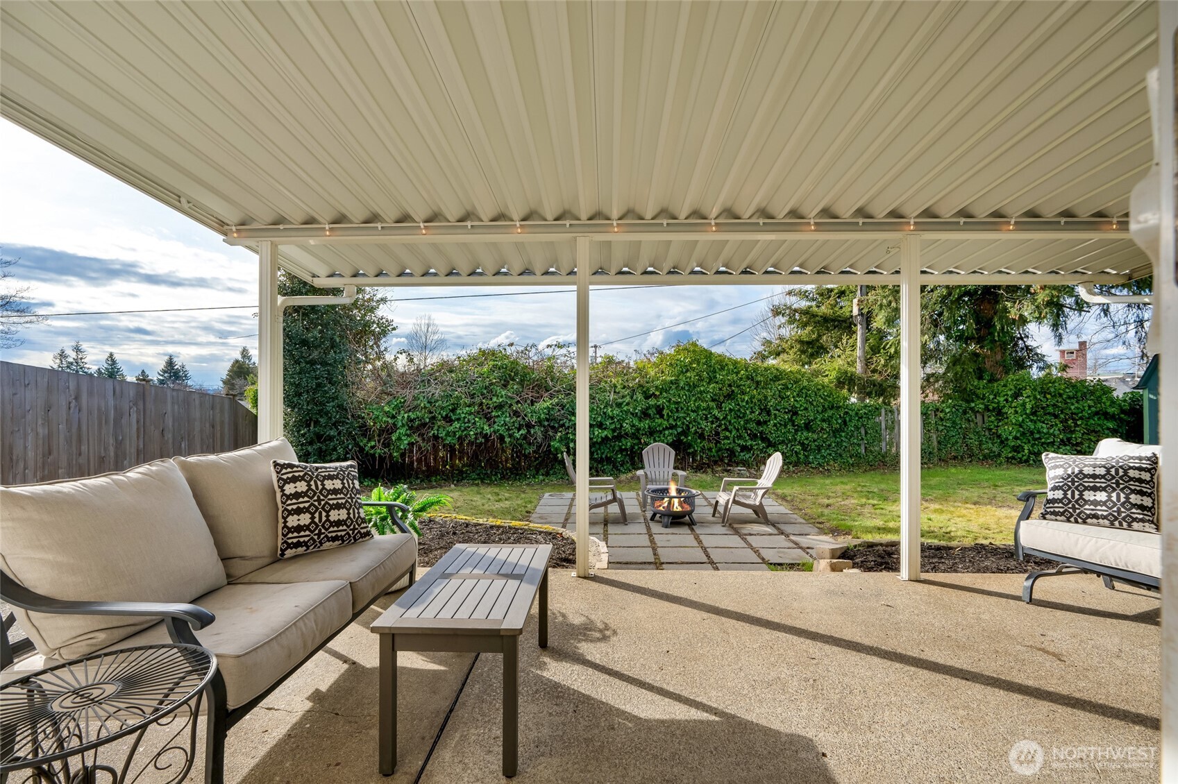 825 Index Court Northeast Renton, WA 98056 - Photo 29 of 40 a view of a patio with a table chairs and a backyard