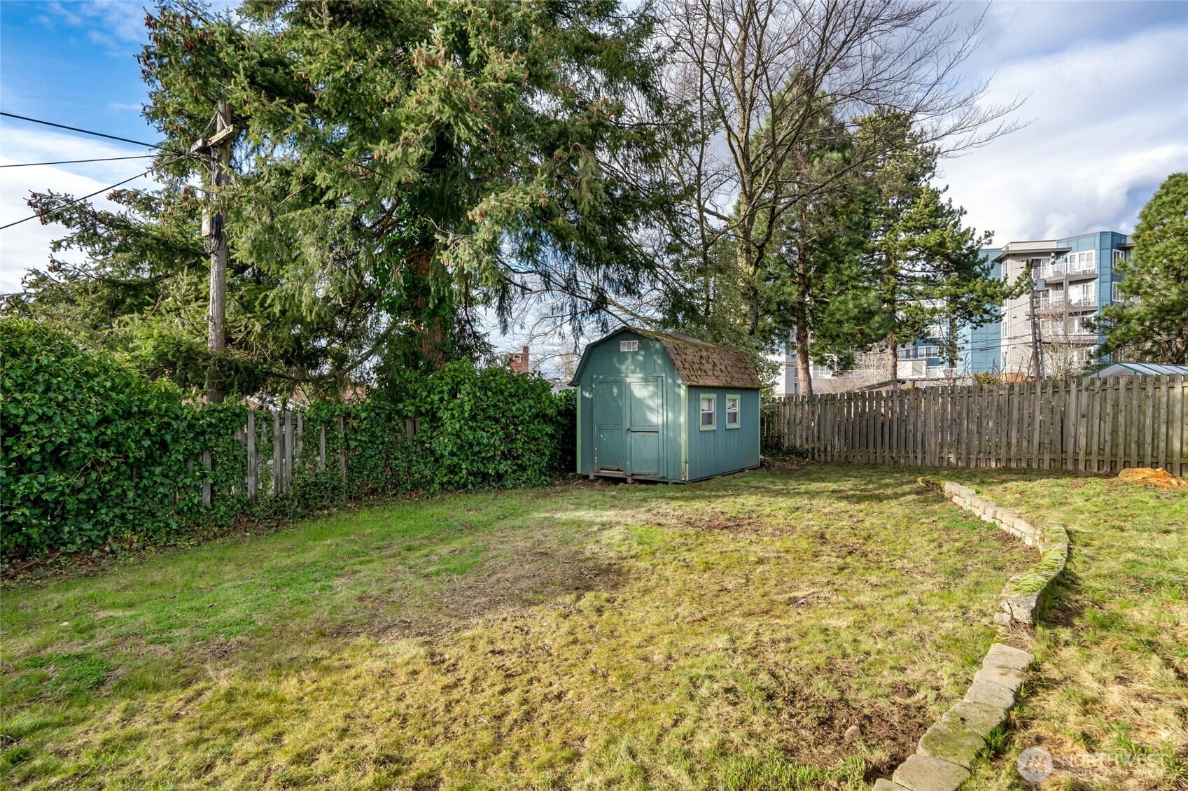 825 Index Court Northeast Renton, WA 98056 - Photo 35 of 40 a backyard of a house with plants and tree
