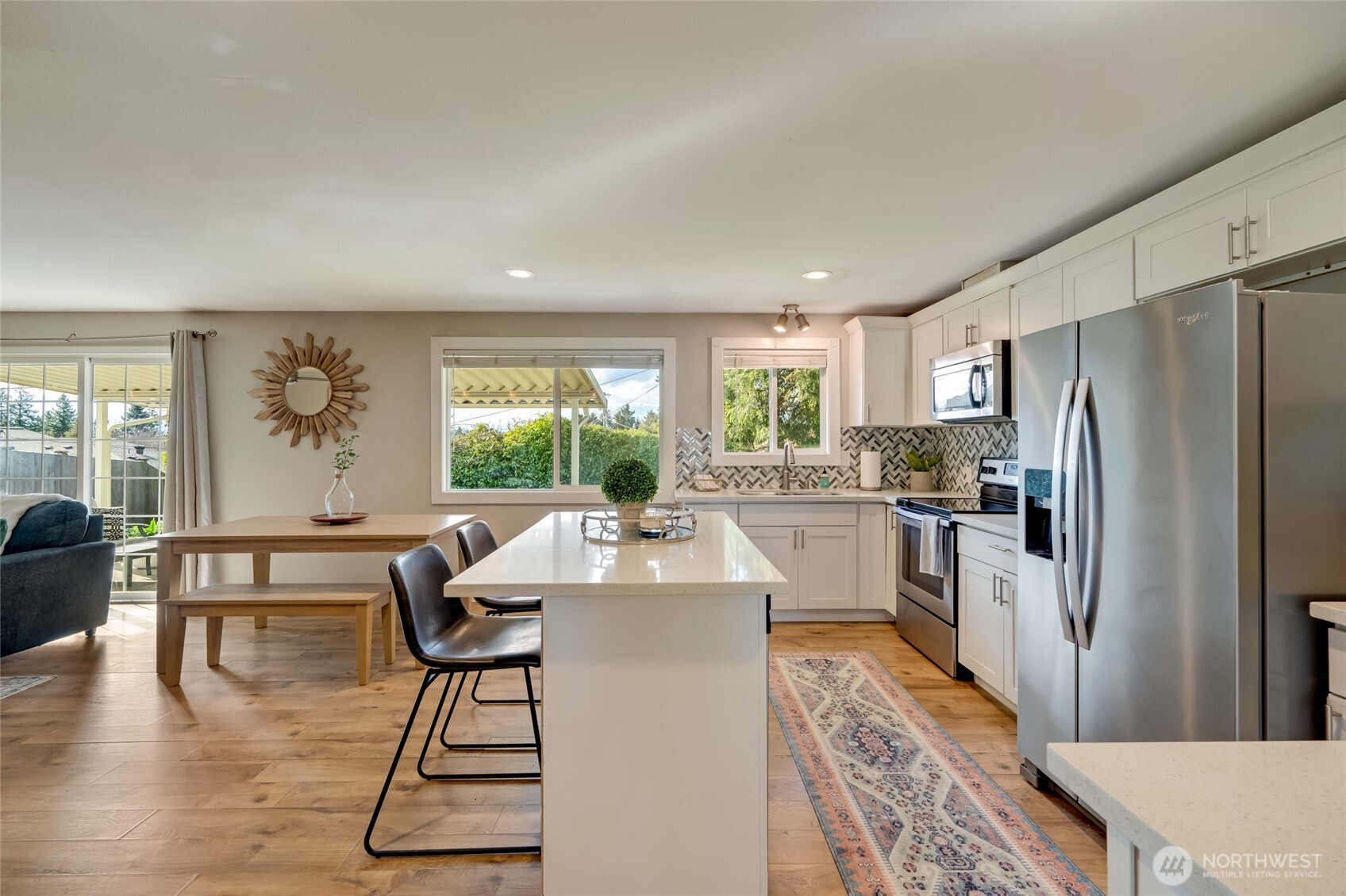 825 Index Court Northeast Renton, WA 98056 - Photo 8 of 40 a kitchen with a table chairs refrigerator and window