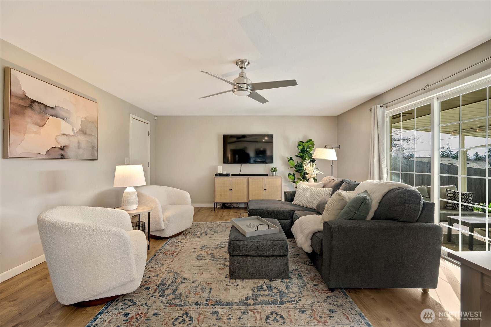825 Index Court Northeast Renton, WA 98056 - Photo 10 of 40 a living room with furniture and a flat screen tv