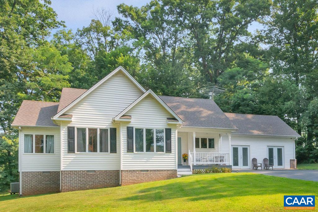 6863 Amicus Road Ruckersville, VA 22968 - Photo 1 of 42 a front view of a house with a yard