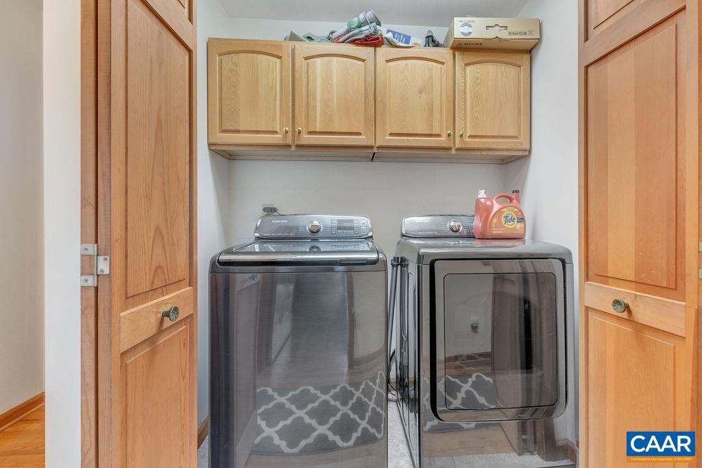 6863 Amicus Road Ruckersville, VA 22968 - Photo 27 of 42 a kitchen with stainless steel appliances granite countertop a refrigerator and cabinets