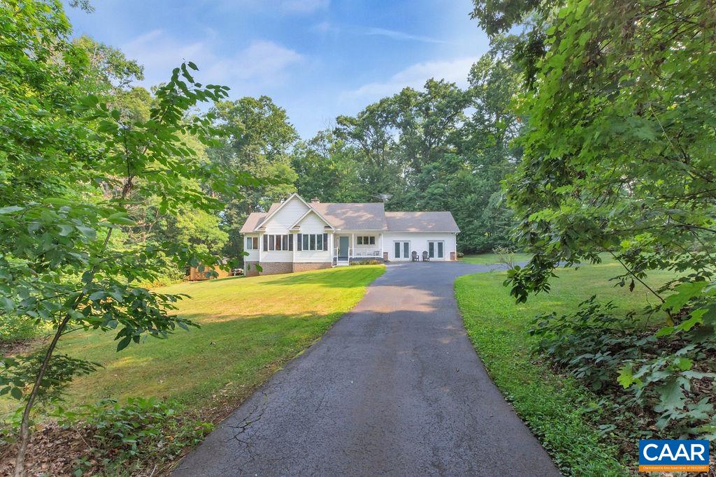 6863 Amicus Road Ruckersville, VA 22968 - Photo 28 of 42 a view of a house with a swimming pool