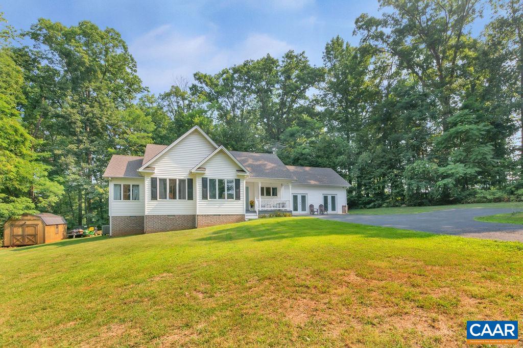 6863 Amicus Road Ruckersville, VA 22968 - Photo 33 of 42 a front view of a house with yard and green space