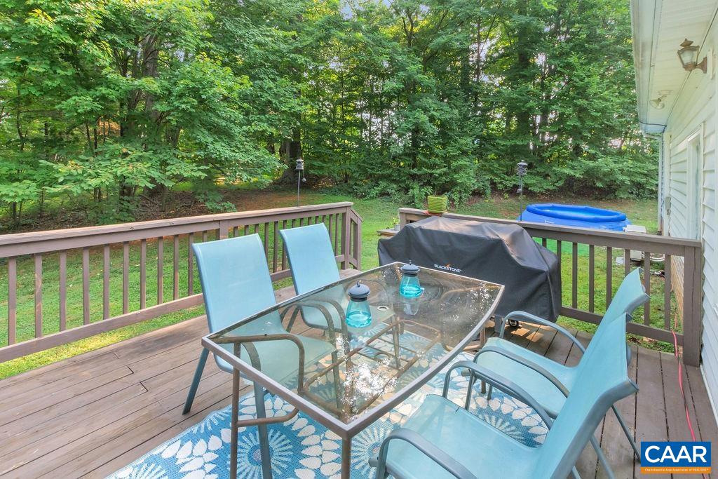 6863 Amicus Road Ruckersville, VA 22968 - Photo 36 of 42 a balcony with wooden floor and outdoor seating