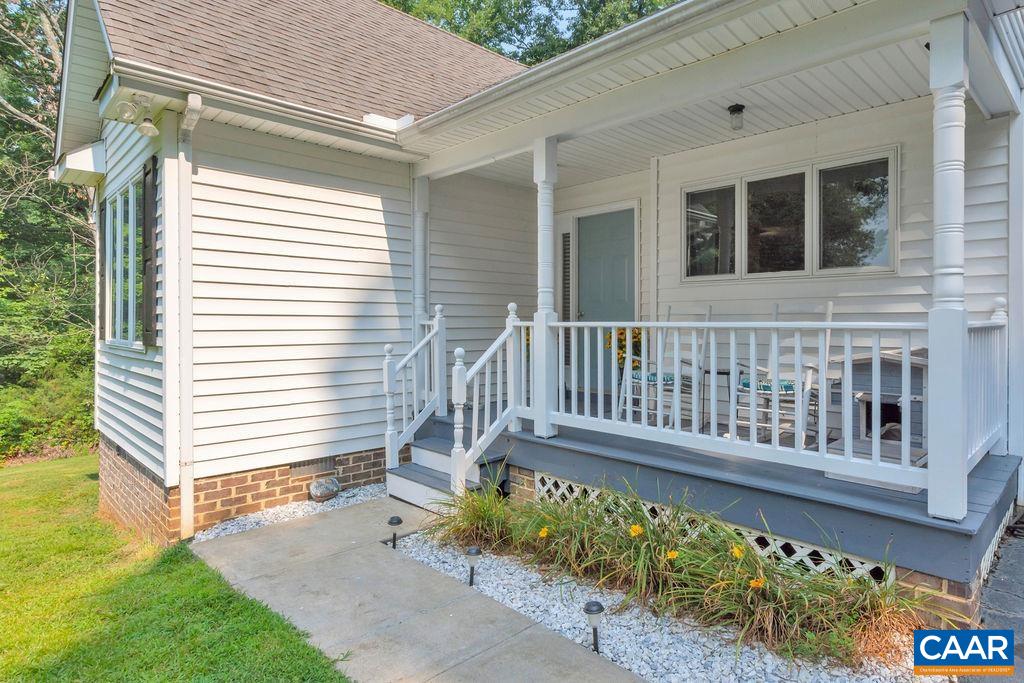 6863 Amicus Road Ruckersville, VA 22968 - Photo 39 of 42 a view of a wooden door with a bench