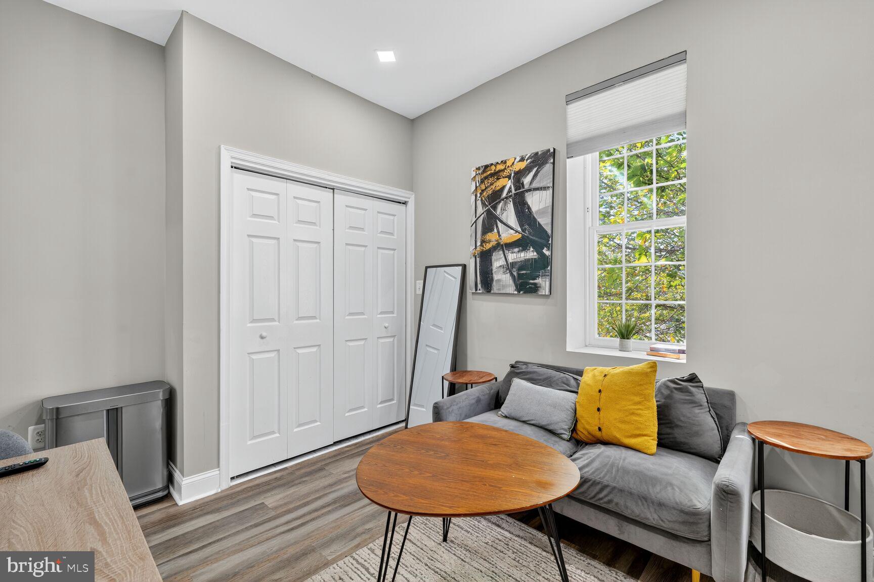 133 7th Street Southeast, Unit 10 Washington, DC 20003 - Photo 8 of 14 a living room with furniture and a window
